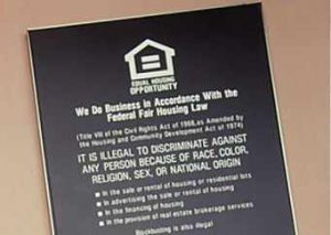 Fair Housing Act non-discrimination notice posted on wall.